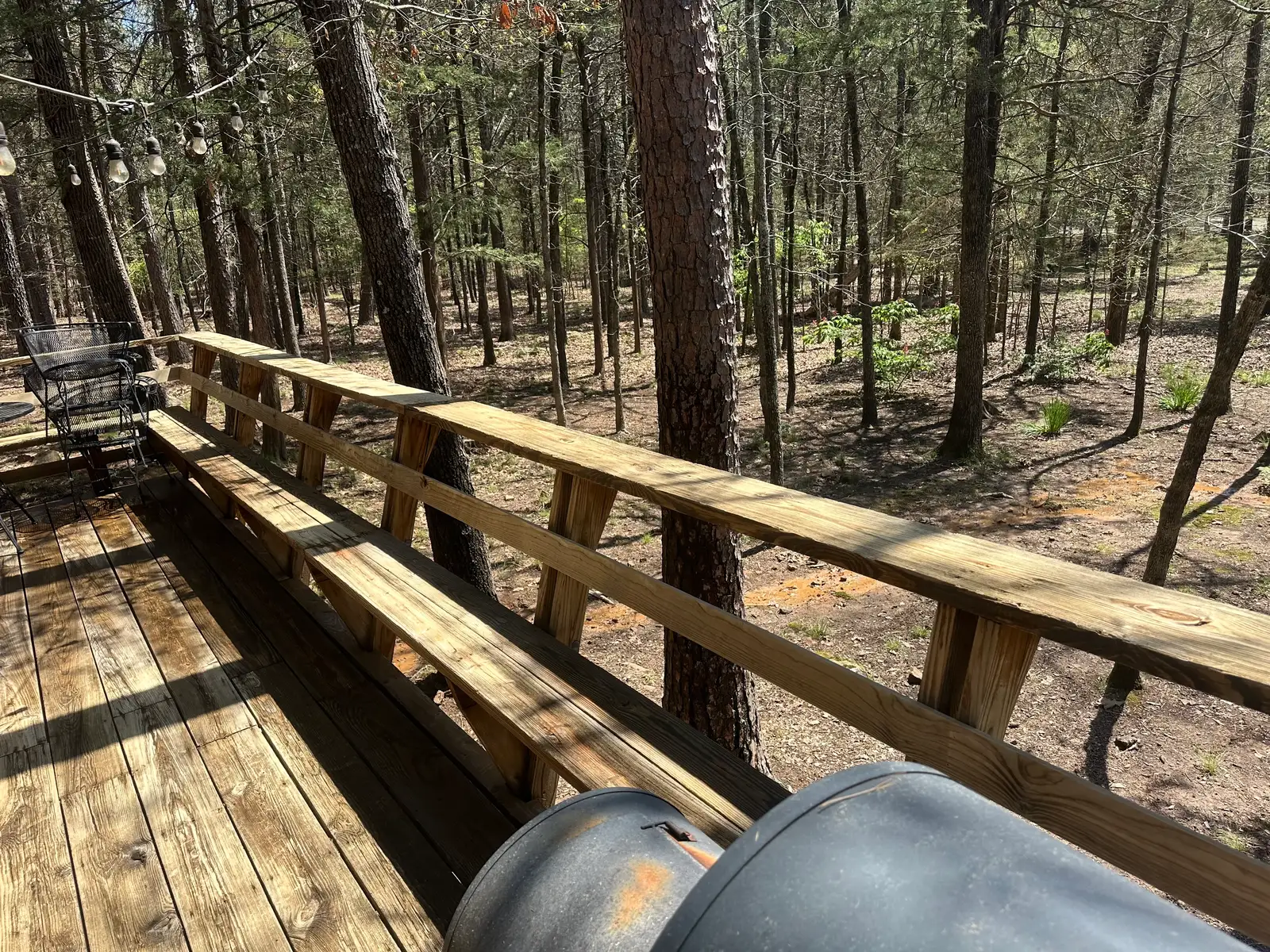 Wood deck and railing cleaned at a Heber Springs cabin property