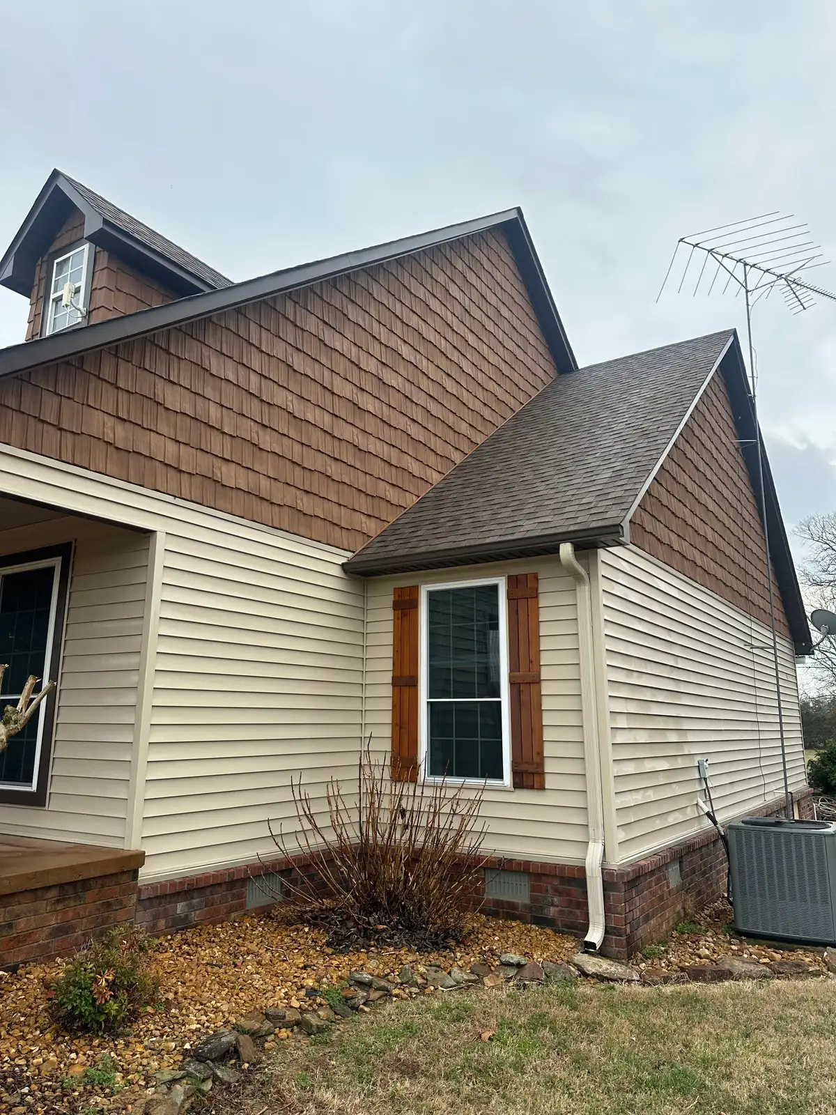 The same siding after soft washing — clean, streak-free finish
