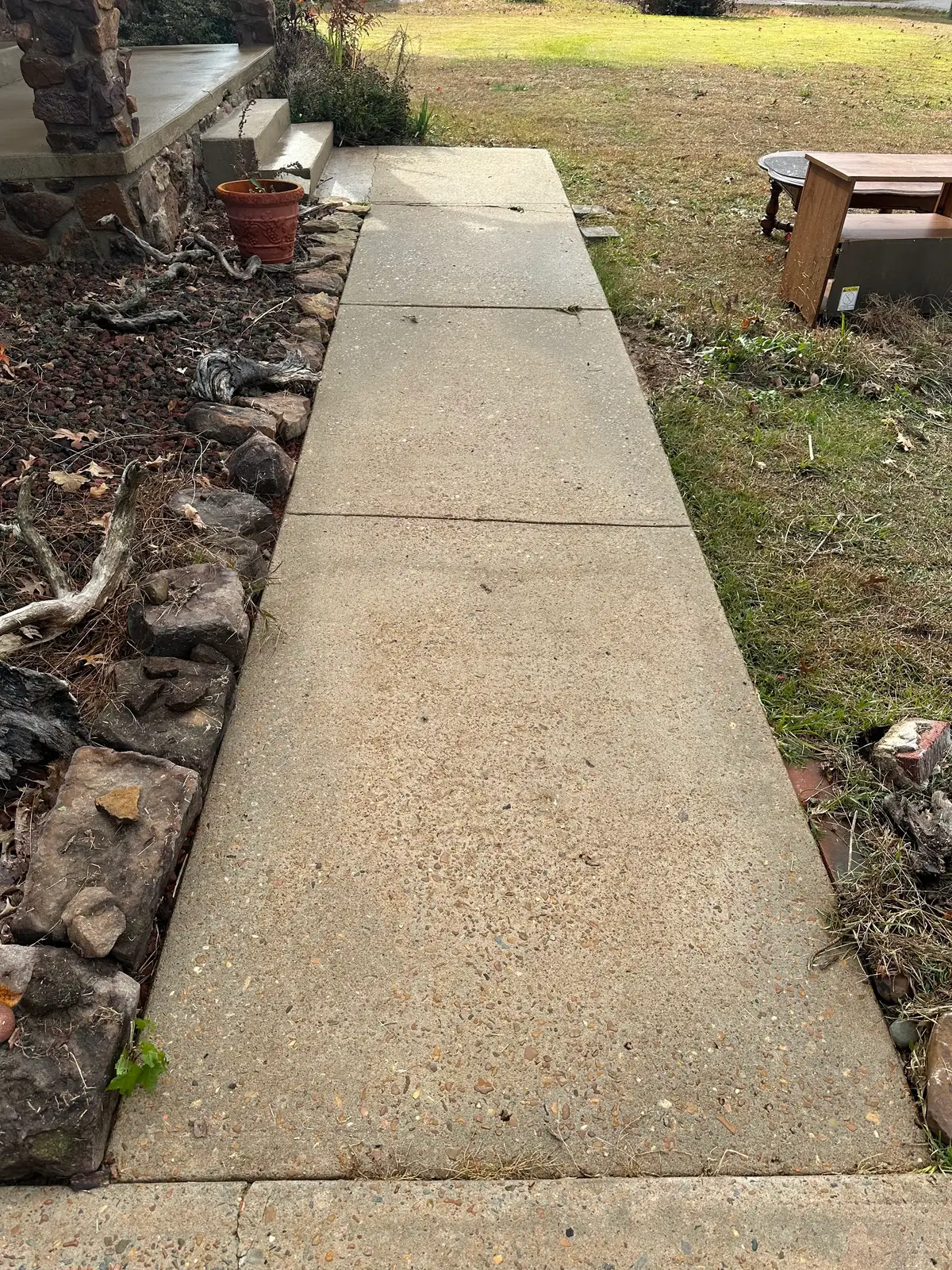 Sidewalk and garden path power washed to remove slick organic buildup in Heber Springs
