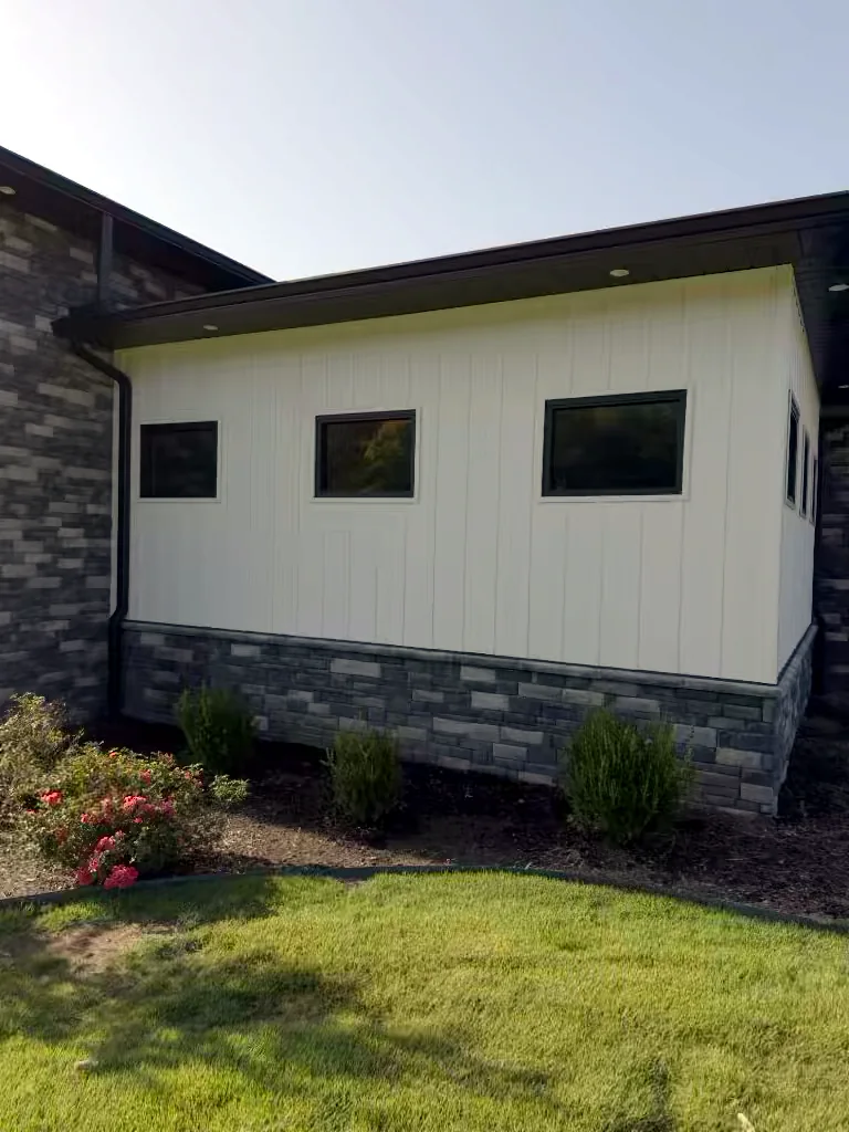 Commercial building window wall in Heber Springs, Arkansas before soft washing — algae and weather staining on the exterior