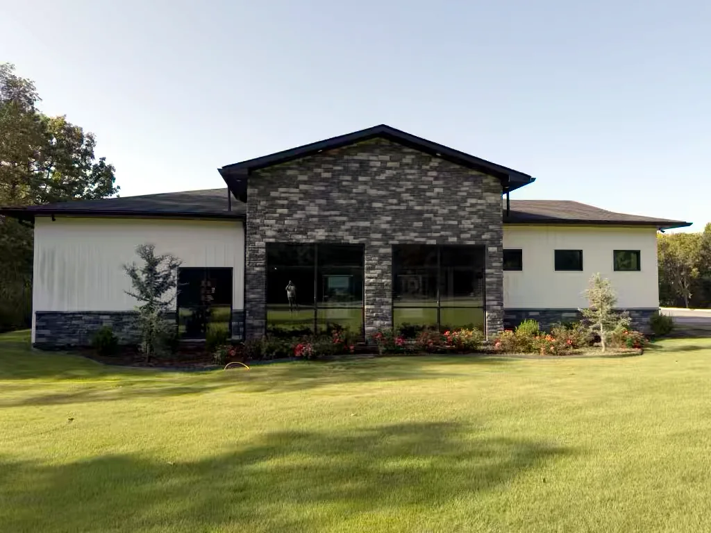 Commercial building front in Heber Springs, Arkansas before soft washing — algae and weather staining on the exterior