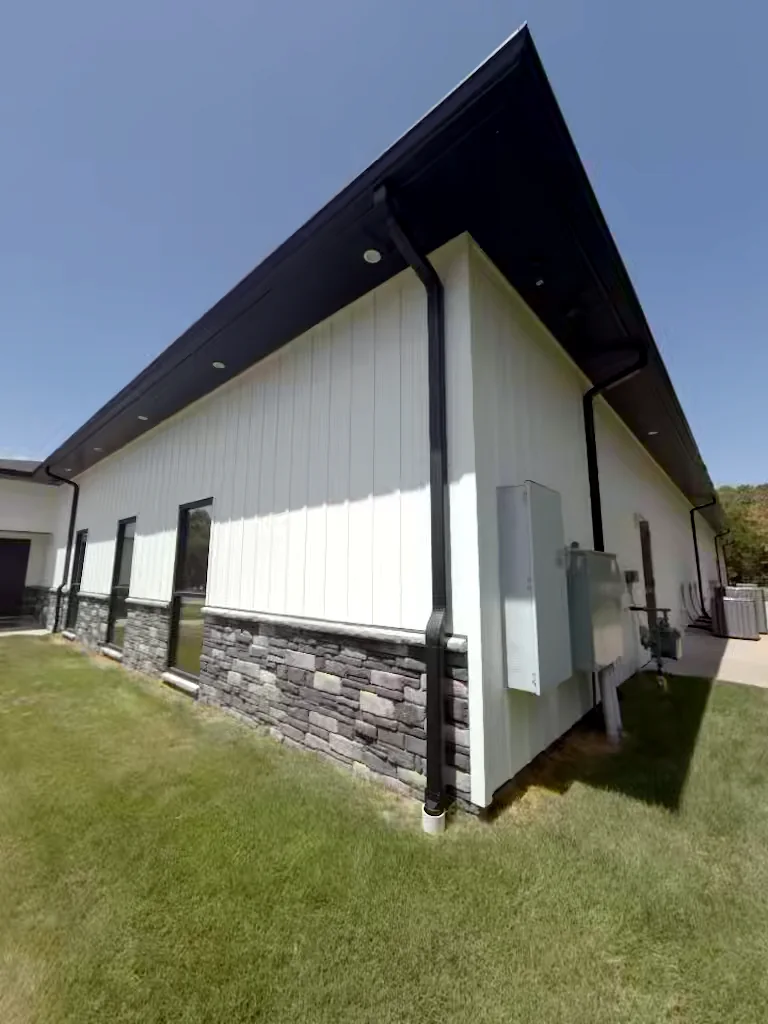 Commercial building utility wall in Heber Springs, Arkansas after soft washing — clean, streak-free exterior