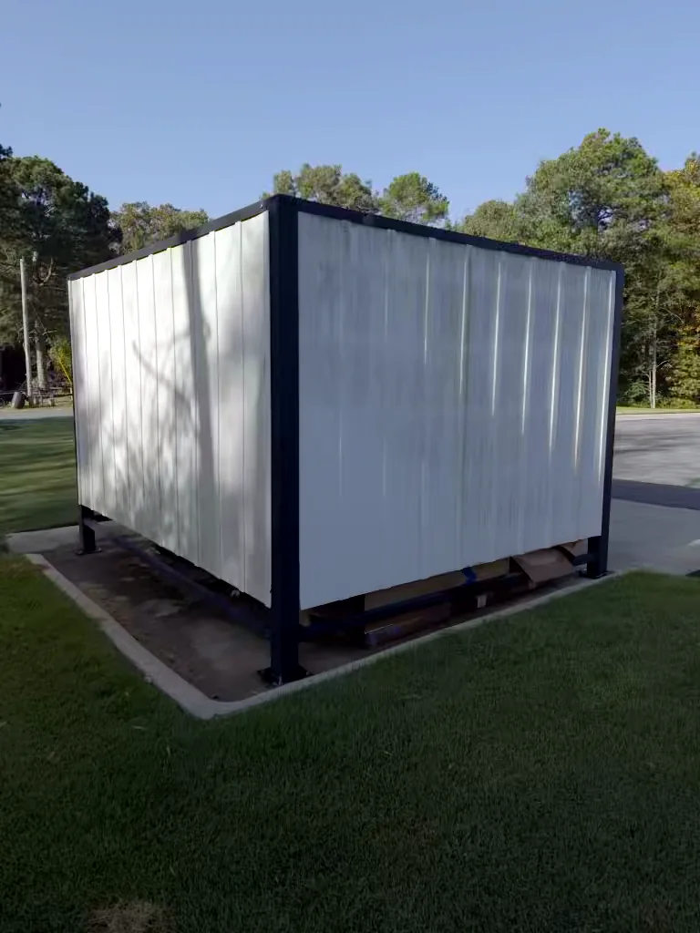 Commercial building outbuilding in Heber Springs, Arkansas before soft washing — algae and weather staining on the exterior