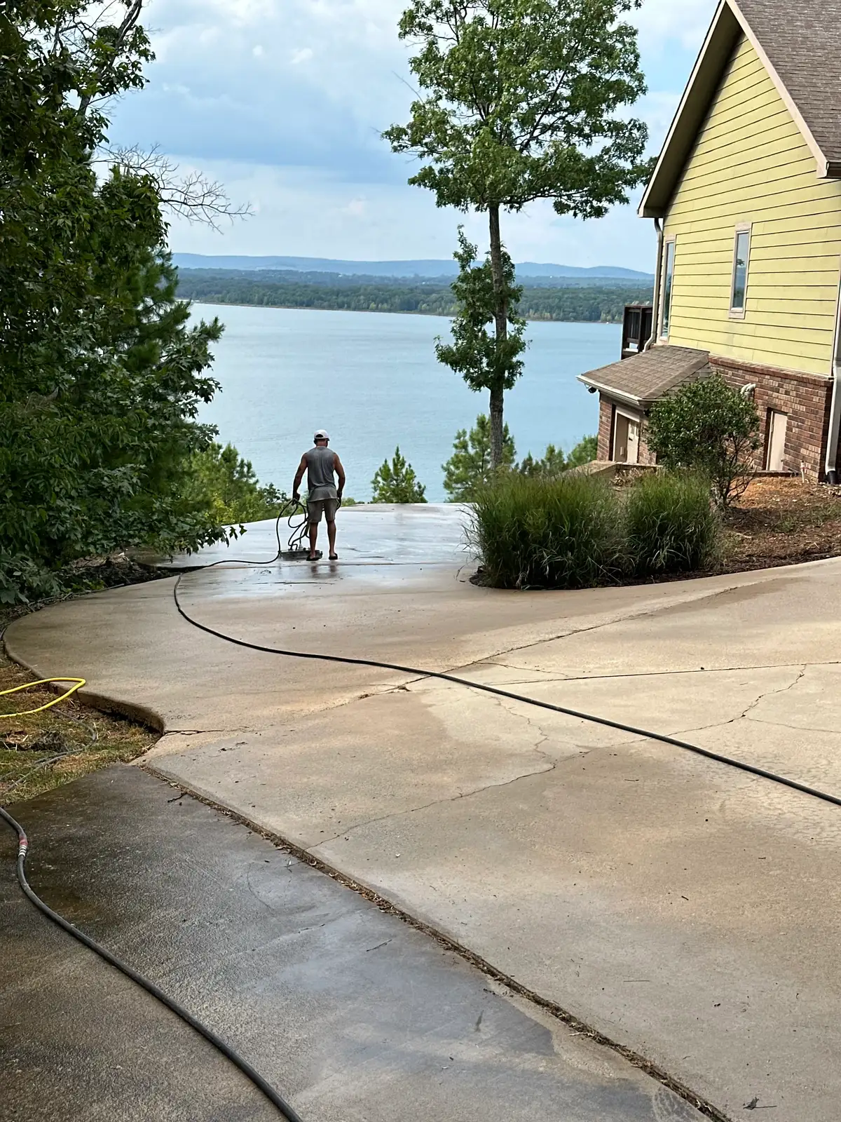 Power washing a lakefront driveway in Heber Springs, Arkansas